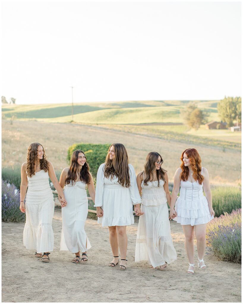 girls walking in lavender field